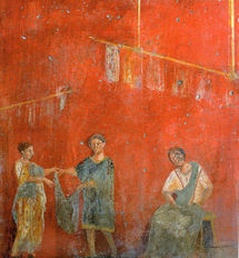 Mural de Pompeya que muestra a mujeres trabajando con un hombre en un  comercio dedicado a la lavandería y a la tintorería (fullonica). Fuente: Wikimedia Commons.