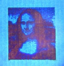 Mona Lisa microscópica, de sólo 50 micras de largo, y 10.000 veces más pequeña que la original. Fuente: DTU.