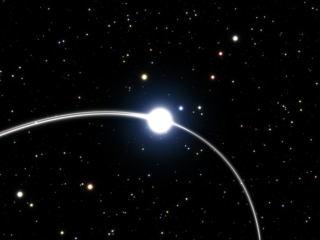 Esta ilustración muestra las órbitas de tres de las estrellas que están muy cerca del agujero negro supermasivo del centro de la Vía Láctea. Este primer plano de la órbita de la estrella S2 muestra cómo el camino de la estrella es ligeramente diferente al pasar por la misma zona de su órbita por segunda vez, 15 años después, debido a los efectos de la relatividad general. Crédito: ESO/M. Parsa/L. Calçada