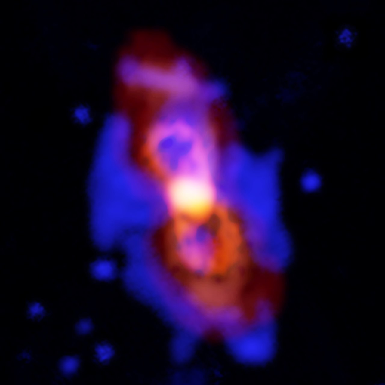 Composición de imágenes de CK Vulpeculae, los restos de una colisión de dos estrellas. Este impacto lanzó moléculas radioactivas al espacio, como se ve en la estructura de doble lóbulo del centro, en colores anaranjados. Crédito: ALMA (ESO/NAOJ/NRAO), T. Kamiński; Gemini, NOAO/AURA/NSF; NRAO/AUI/NSF, B. Saxton