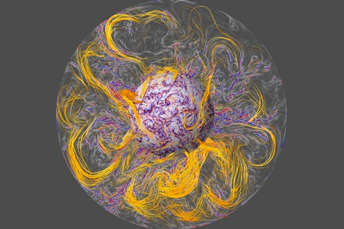 Así es como se aprecia el interior del núcleo de la Tierra según la simulación informática. Las líneas de fuerza del campo magnético (en naranja) se alargan por convección turbulenta (en azul y rojo). Las ondas hidromagnéticas se emiten desde el interior del núcleo y se propagan a lo largo de líneas de fuerza de campo hasta la superficie del núcleo, donde se enfocan para crear una agitación geomagnética. © Aubert et al./IPGP/CNRS Photo Library