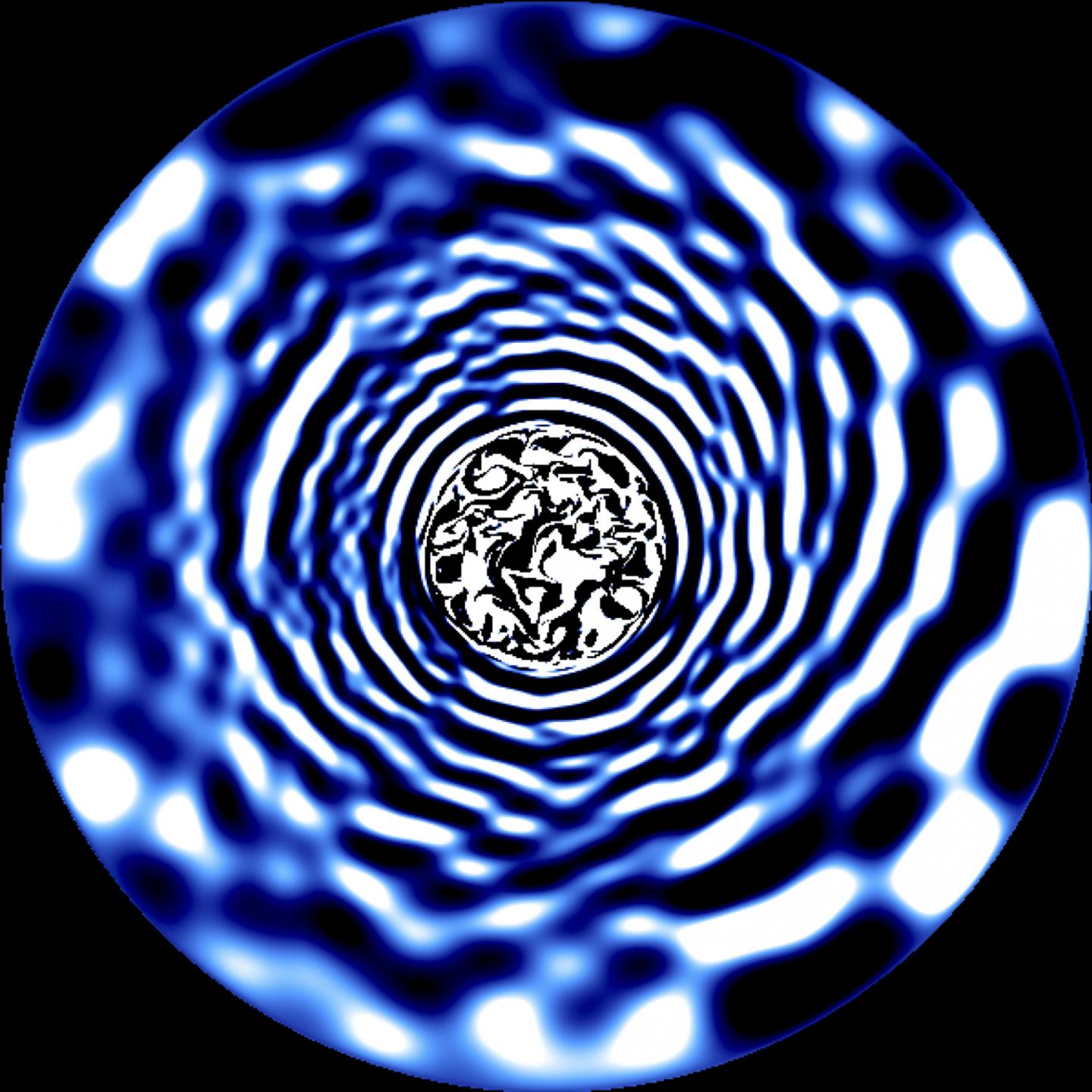 Fotograma de una simulación hidrodinámica del interior de una estrella que tiene una masa tres veces la de el Sol. Las zonas brillantes y oscuras representan fluctuaciones de temperatura que se propagan desde el interior de la estrella hasta su superficie debido la existencia de ondas producidas en un núcleo convectivo turbulento. Crédito: Tamara Rogers.