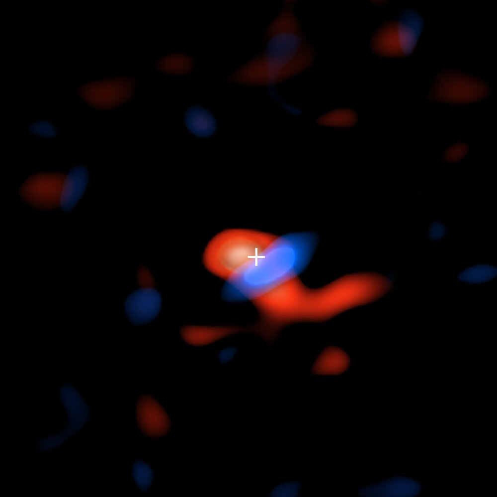 Imagen del frío disco de gas de hidrógeno alrededor del agujero negro supermasivo al centro de nuestra galaxia. Los colores representas el movimiento del gas en relación a la Tierra: el gas en rojo se está alejando, provocando que las ondas de radio detectadas por ALMA se corran hacia el rojo; mientras que el gas en azul se está acercando a la Tierra, provocando un corrimiento hacia el azul. Crédito: ALMA (ESO/NAOJ/NRAO), E.M. Murchikova; NRAO/AUI/NSF, S. Dagnello