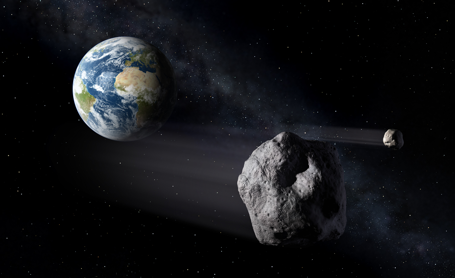 Impresión artística de asteroides que pasando cerca de la Tierra. Fuente: ESA.