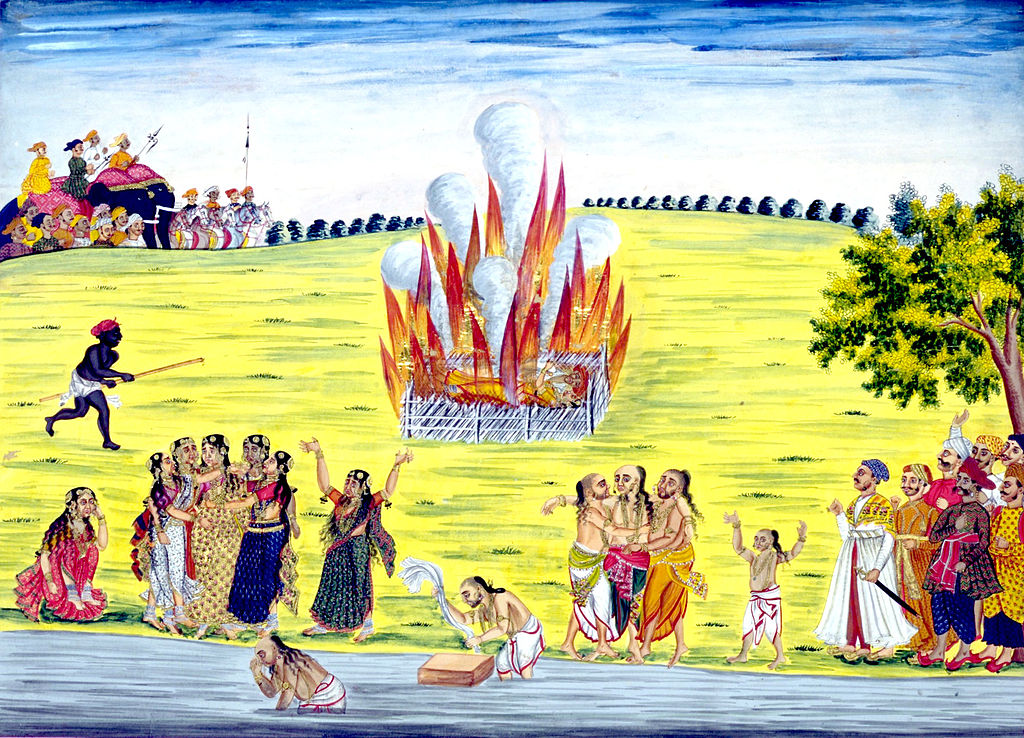 Pintura (ca. 1800) de una ceremonia Sati de la India, en la cual una viuda se quema en una pira con el cadáver de su marido. La práctica está abolida legalmente pero se sigue practicando de forma clandestina. Autor: Desconocido. Fuente: Wikipedia.