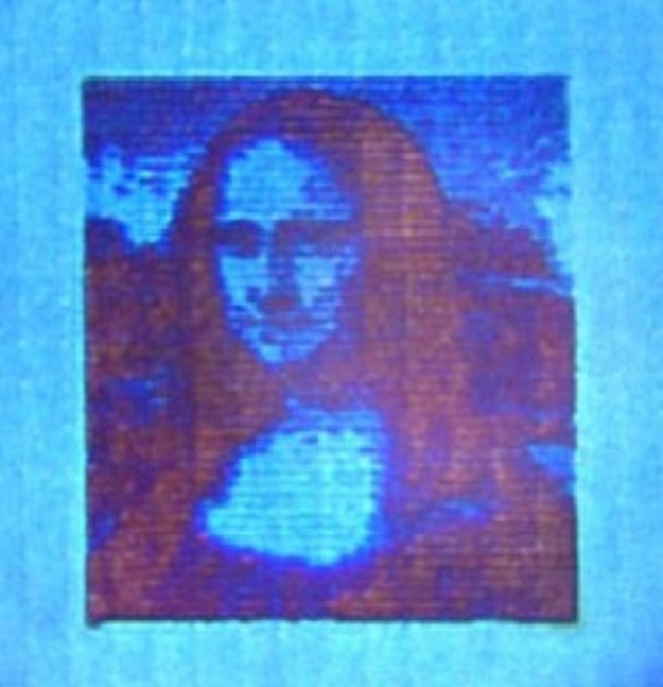Mona Lisa microscópica, de sólo 50 micras de largo, y 10.000 veces más pequeña que la original. Fuente: DTU.